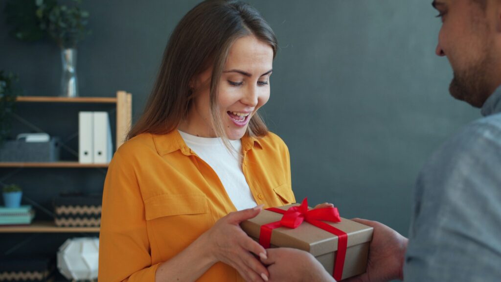 Woman accepting a Valentine's gift