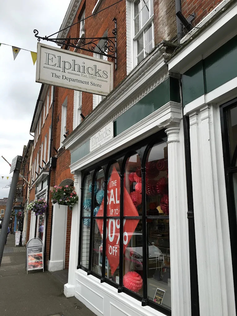 Hanging sign and front window of Elphicks in Farnham